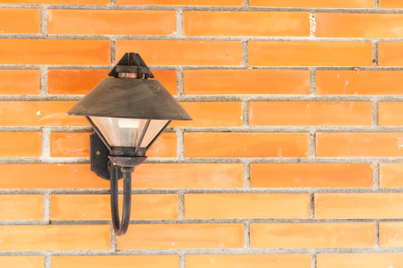 Wall lamp on brick backgroundの写真素材