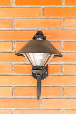 Wall lamp on brick backgroundの写真素材