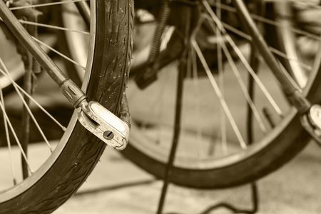 Security lock blocking the bicycle wheel in parkのeditorial素材