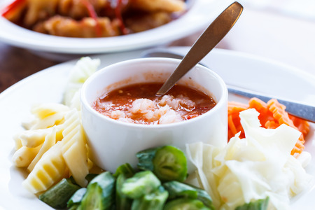chili sauce with vegetable on dishの写真素材