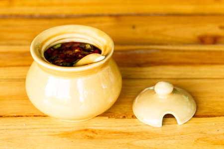 Chilli and fish sauce for thai food with wooden background-3の写真素材