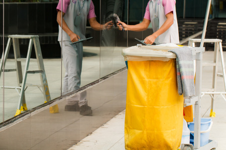 Mop bucket with cleaner backgroundの写真素材
