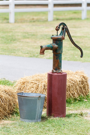 Retro style hand water pump (old water pump)の写真素材