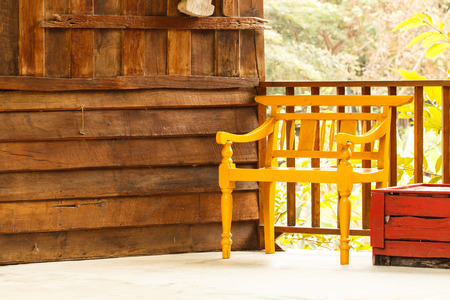 Yellow wooden chair with home wall backgroundの写真素材