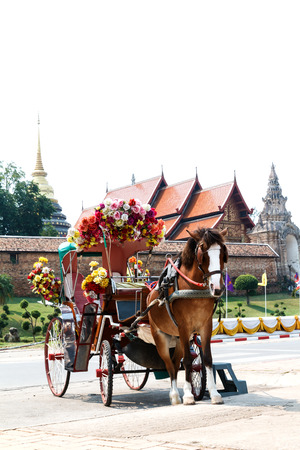 Horse carriage at Phrathat Lampang Luang temple in Lampang, Thailandの写真素材