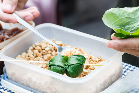Food wrapped in leaves or Miang Kham sold as local market, Thailand-6の写真素材