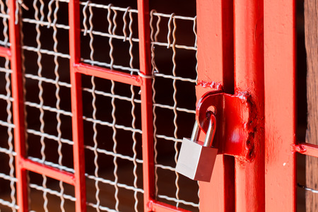 Concept of key lock in red borderの写真素材