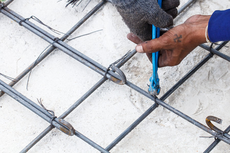 Construction worker with work in the cement formwork framesの写真素材