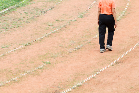 Part of woman walk in the soccer fieldの写真素材