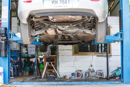 NONTHABURI , THAILAND -JULY 11 2015: Private car. Mazda 3 with orbital polisher in auto car repair shop. Photo at local repair shop Nonthaburi, thailand.のeditorial素材