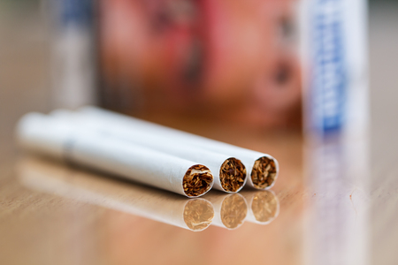 Close-up of cigarettes and waning pack background-2の写真素材