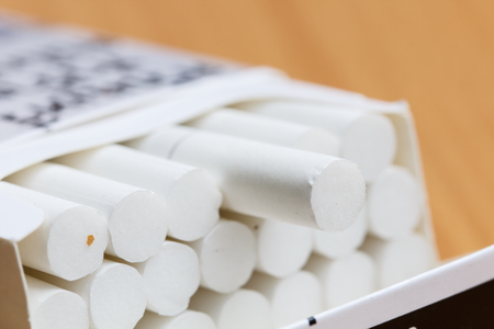 Pack of cigarettes and wooden backgroundの写真素材
