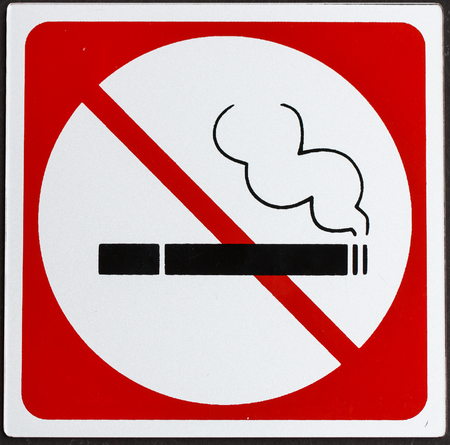 Symbol of no smoking on black  backgroundの写真素材