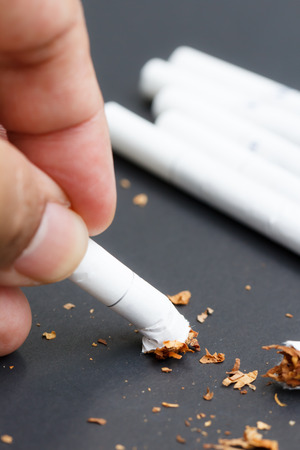Quit smoking concept of hand crushing cigarette-2の写真素材