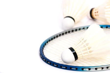 Badminton shuttlecocks and rackets isolated on whiteの写真素材