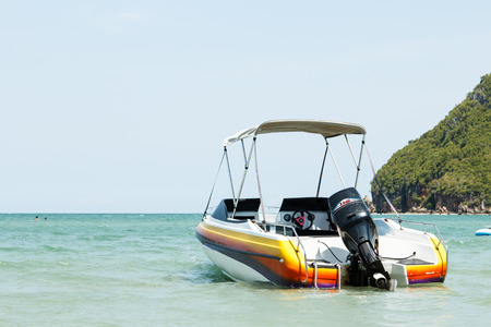 speed boat parking near the beachの写真素材