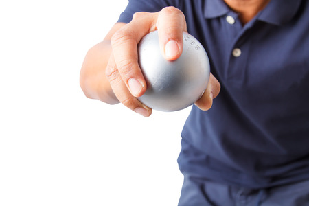 Man and petanque ball in hand isolated on white backgroundの写真素材