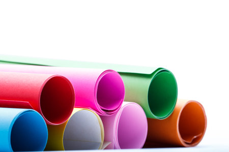 Rolls of color paper on white background