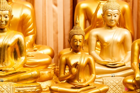 Golden buddha in public templeの写真素材
