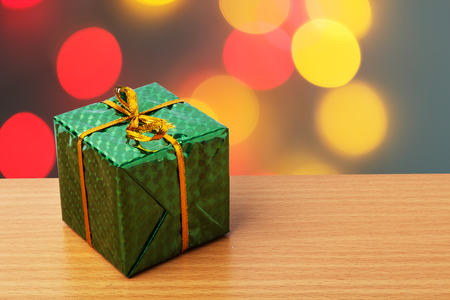 Green bax xmas with red and yellow bokehの写真素材