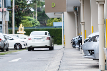 Car parking in car park on daytimeの写真素材