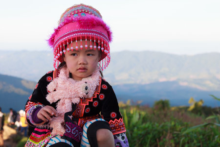 CHIANG RAI PROVINCE, THAILAND - NOV 20, 2016 : Unidentified Hmong hill tribe girl siiting alone, Thailand on November 20 ,2016.のeditorial素材