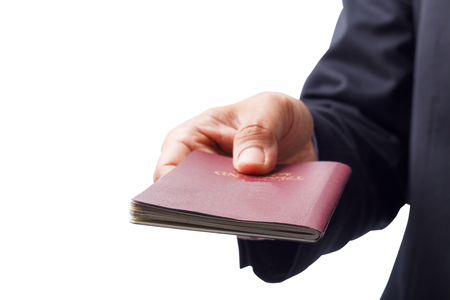 Business hand man with Thailand passport isolated on whiteの写真素材