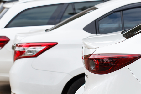 White car parking lot in line outdoorの写真素材