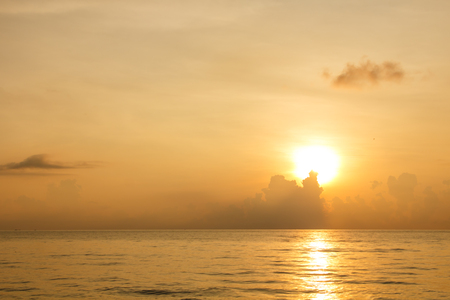 Golden water sea background on sunset over seaの写真素材