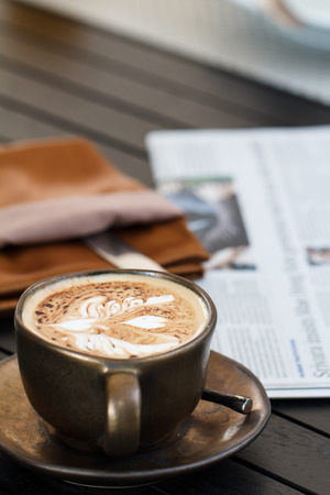 Cup of coffee with newspaperの写真素材