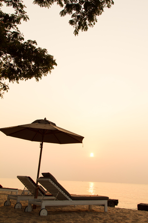 Beach chair and sunset in morningの写真素材