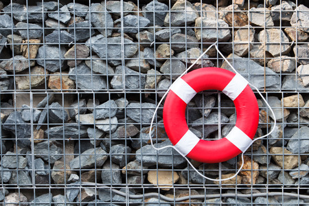 Red life buoy at swimming poolの写真素材