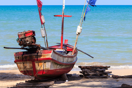Fisherman boat park on sea beachの写真素材