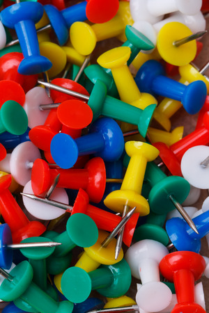 Set of different colors pushpins board backgroundの写真素材