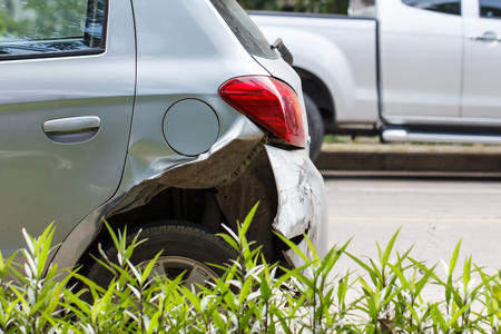 Silver car damaged by road traffic accident Wait for the insurance company to evaluate the repair.の写真素材