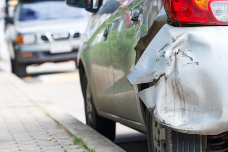 Back of silver car damaged by road traffic accident Wait for the insurance company to evaluate the repair.の写真素材