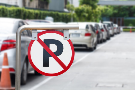 Do not park the car parking warning signs are prohibited with the background is a long blurred vehicle.の写真素材