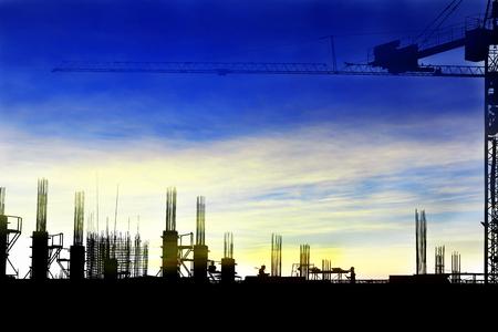 Silhouette images of construction sites are underway and workers are working.の写真素材