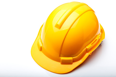 The yellow hard hat construction isolated on white backgroundの写真素材