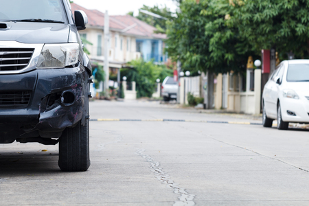 Black cars damaged by road traffic accident Wait for the insurance company to evaluate the repairの写真素材