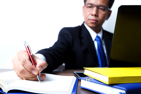 Hand writing, concept of businessman busy and hard workの写真素材