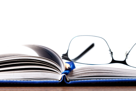 The notebook paired with glasses and pencil, the concept of vision and learning.の写真素材