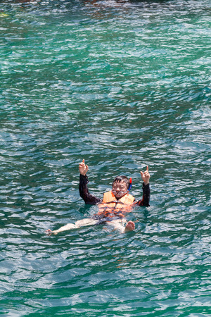 Asian man  snorkeling with relaxed and happy way at sea beach vacationの写真素材