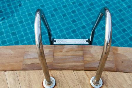 Grab bars ladder in the swimming poolの写真素材