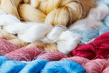 Silk cotton prepare for weave on the manual wood loom in Thailand, selective focusの写真素材