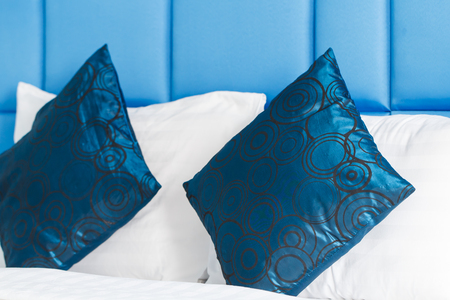 Blue pillow on bed n blue color bed room interiorの写真素材