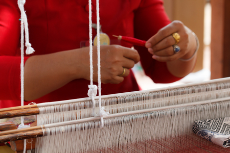 weaving silk cotton on the manual wood loom in Thailand, selective focusの写真素材