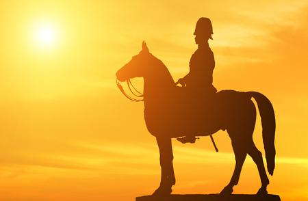Silhouette Cavalry statue ride horse with sunset background.の写真素材
