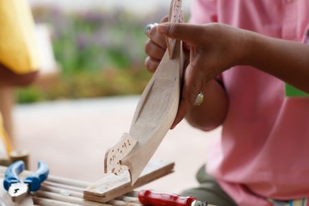 Traditional craftsman making wooden boatの写真素材