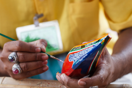 Man working small boat craft wooden with painting colorの写真素材